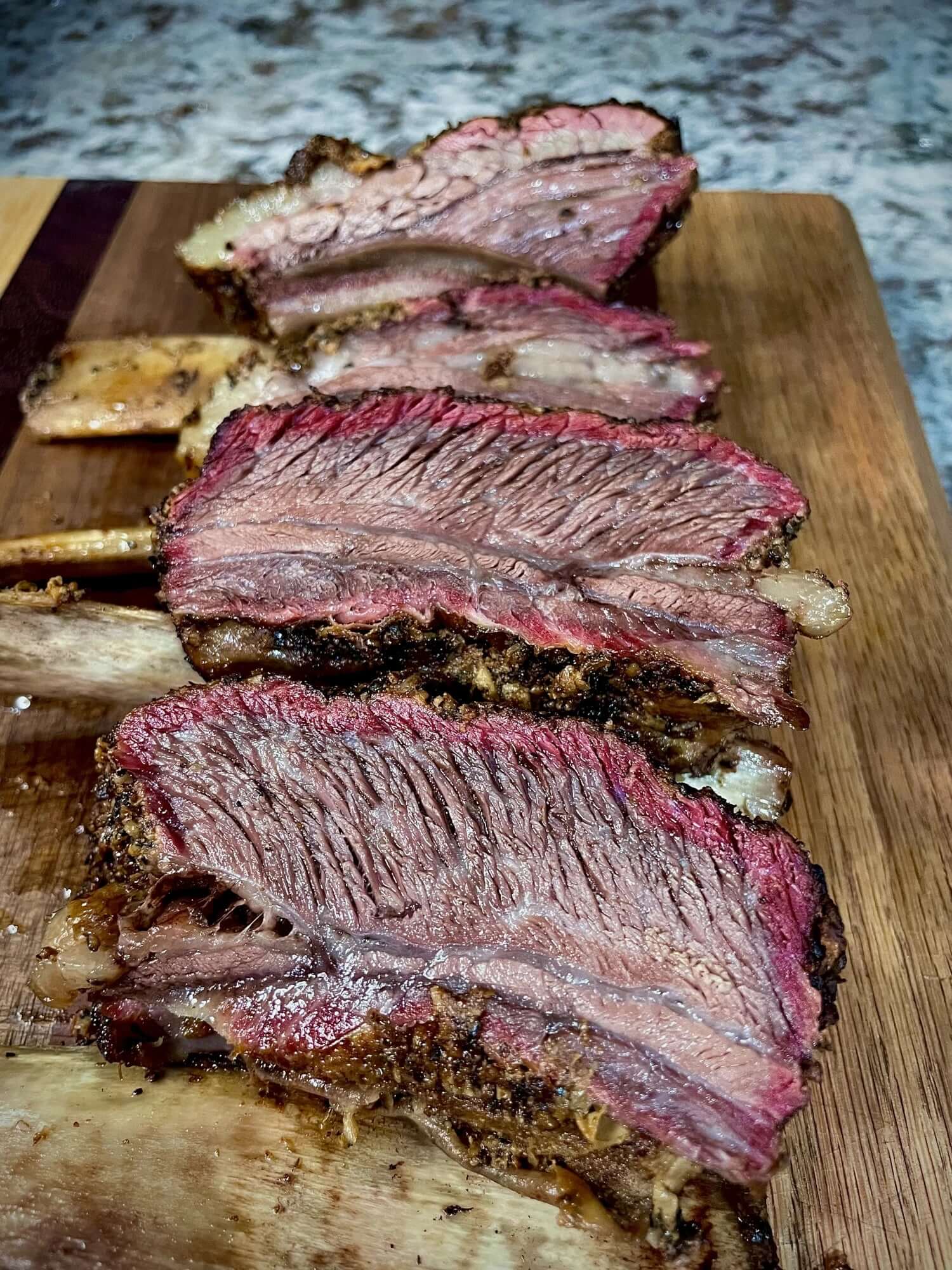 Thick-cut, meaty grass-fed, grain-finished beef ribs with rich marbling.